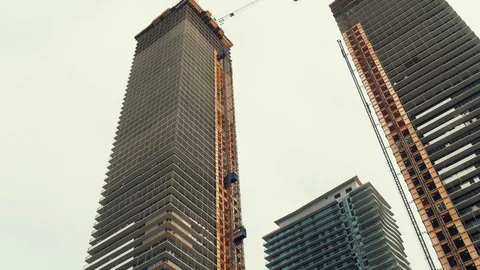 Condo Towers being Build - Elevators Moving Stock Footage 96486497