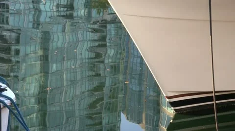 Condo Water Reflection And Boat Bow Stock Footage 12582533