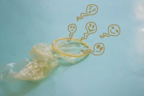 Condom and sperm. Stock Photos