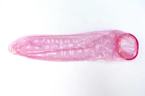 Condom is available on white background. Stock Photos