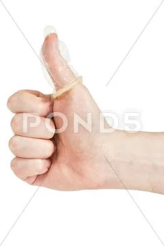 Condom on the finger Stock Photos