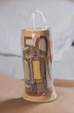 Condom money Stock Photos