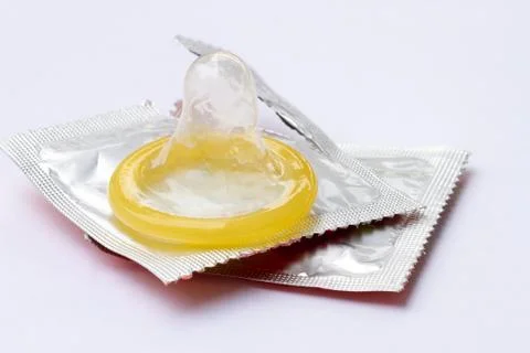 Condom on white background Stock Photos