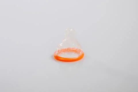 Condom on a white background Stock Photos