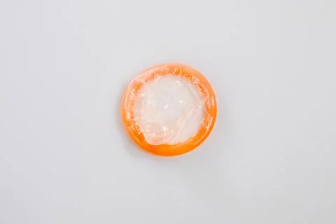 Condom on a white background Stock Photos