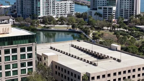Condominium Blocks and Office Decks Around a Rocky Point Lagoon Vídeo Stock 329451509