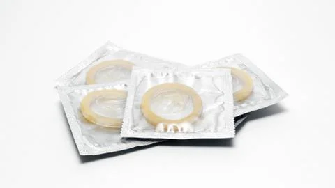 Condoms pack on a white background Stock Photos
