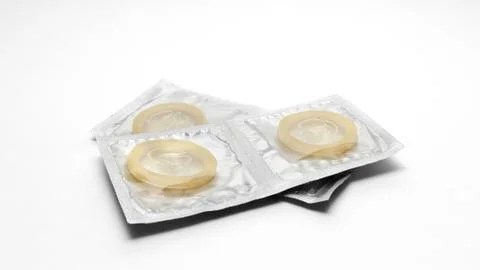 Condoms pack on a white background Stock Photos