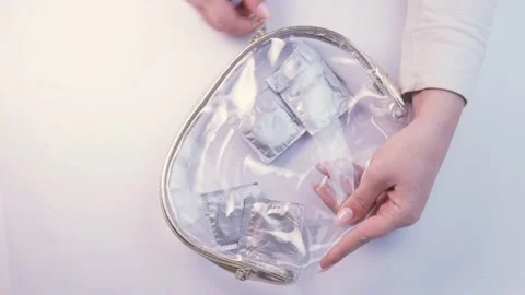 Condoms in transparent handbag Stock Footage 237497512