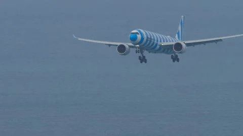 Condor Airbus A330-900 D-ANRT on final approach over sea in Phuket Stock Footage 343165243