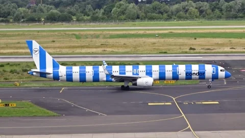 Condor boeing 757 blue stripes taxiing dusseldorf airport aircraft's design Stock Footage 286207234