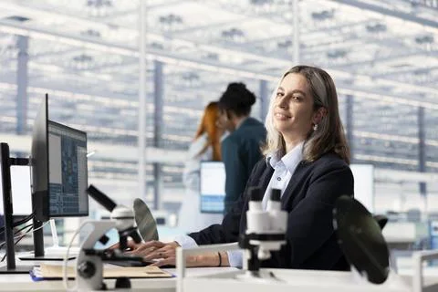 Conducting feasibility study SoC architecture design and smiling female engineer Stock Photos