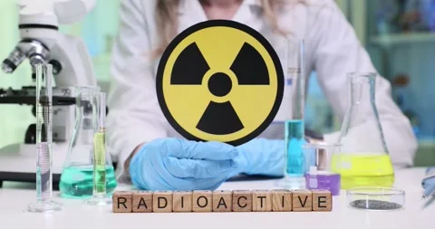 Conducting a Laboratory Experiment Featuring a Radioactive Symbol Along with Stock Footage 312175105