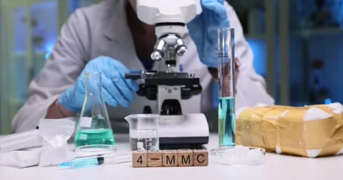 Conducting Laboratory Research Utilizing a Microscope Alongside Various Stock Footage 312174558