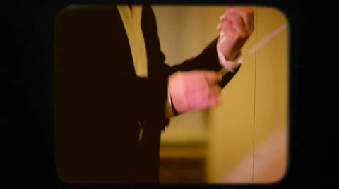 Conducting an orchestra. Retro Stock Footage 52080393