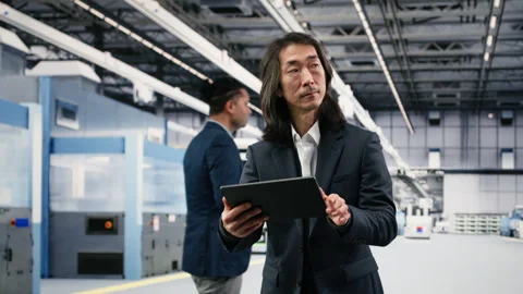 Conducting study on components, tablet and cheerful microchip factory manager Stock Footage 333394880
