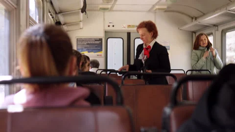 The conductor is checking the tickets in the train. Stock Footage 188840934