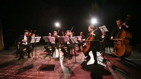 Conductor conducting an orchestra on stage Stock Footage 45174633