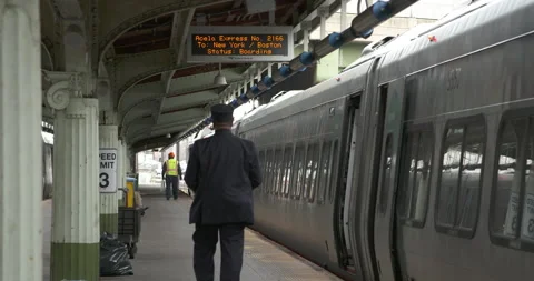 Conductor walking to train Stock Footage 239359612