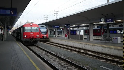 Conductor waving, ÖBB train leaving the train station Linz Stock Footage 122080617
