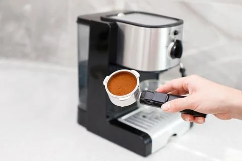 Cone with ground coffee. coffee machine at home Stock Photos