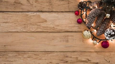 Cones with burning garland on table. High quality photo Stock Photos