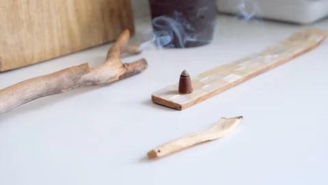 Cones Incense on a  table.  Glowing incense with smoke. Relaxation Stock Footage 111344027