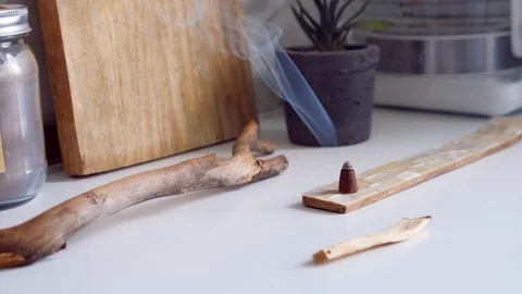 Cones Incense on a  table.  Glowing incense with smoke. Relaxation Stock Footage 111344037