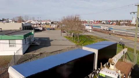 Conestoga Trailer With Flatbed And Crane Truck Parked Along Trans-Canada Stock Footage 333364913