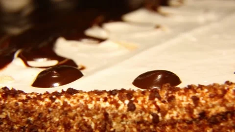 The confection is spinning. Chocolate cake in motion, up close Macro video Stock Footage 167744941