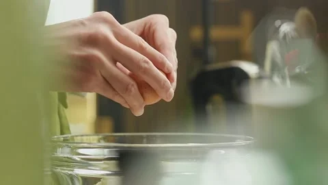 Confectioner adds egg to the mixture. Stock Footage 151688841