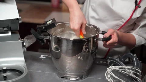 Confectioner blogger records on webcam process of kneading meringue cream Stock Footage 166751927
