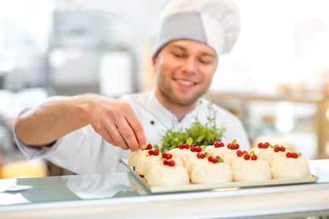 Confectioner with cakes Stock Photos