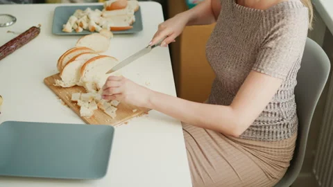 Confectioner Chopping Cake Loaf Into Tiny Cubes On Wooden Board Stock Footage 307978260