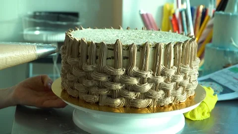 The confectioner decorates a cake Stock Footage 85667129