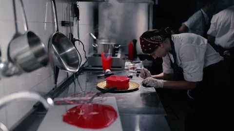 Confectioner decorates chocolate sphere. Stock Footage
