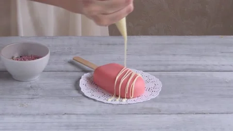 Confectioner decorating ice cream cake with white chocolate. Close up. Step 2 Stock Footage 150463774
