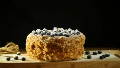 A confectioner, dusting with a powder of sugar glaze over a delicious decadent Stock Footage 80789519