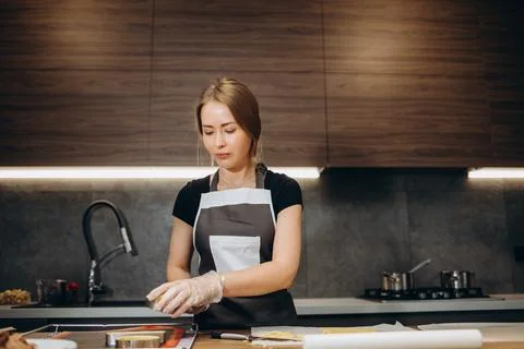 The confectioner forms gingerbread cookies using an original rectangular cutt Stock Photos