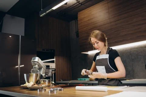 The confectioner forms gingerbread cookies using an original rectangular cutt Stock Photos