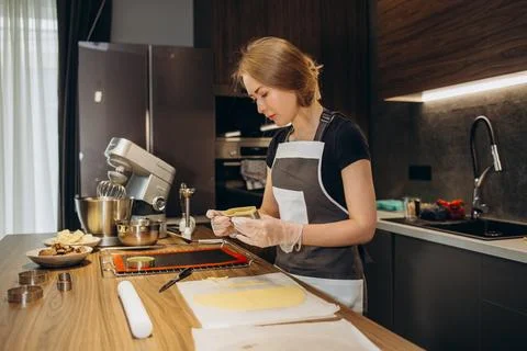 The confectioner forms gingerbread cookies using an original rectangular cutt Stock Photos