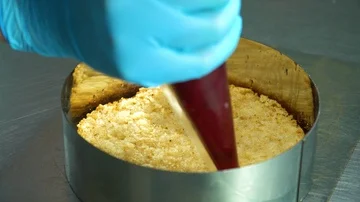 The confectioner makes a layer of jam Stock Footage 85662922