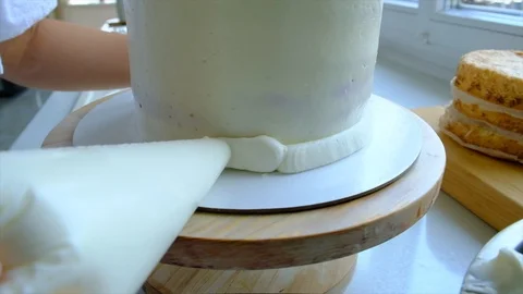 A confectioner prepares a cream cake. Stock Footage 113014064
