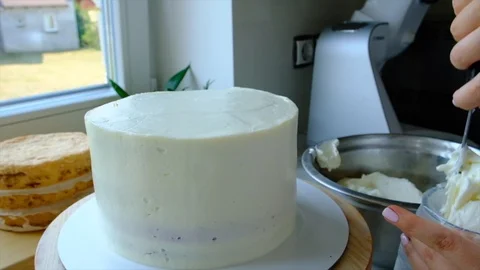 A confectioner prepares a cream cake. Stock Footage 113014210