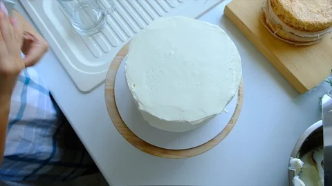 A confectioner prepares a cream cake. Stock Footage 113014406