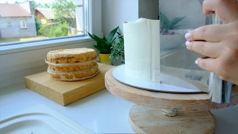 A confectioner prepares a cream cake. Stock Footage 113014445