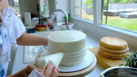 A confectioner prepares a cream cake. Stock Footage 113014654