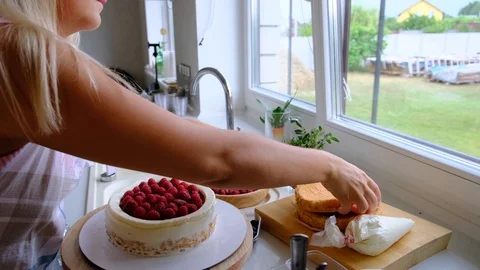 A confectioner prepares a cream cake. Stock Footage 113017291