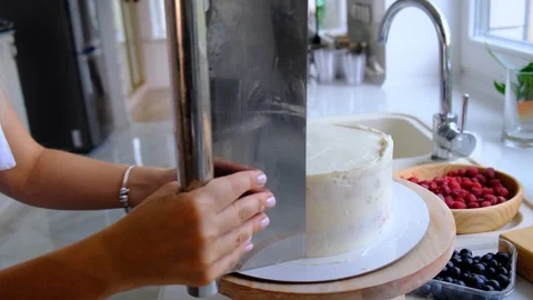 A confectioner prepares a cream cake. Stock Footage 113017554