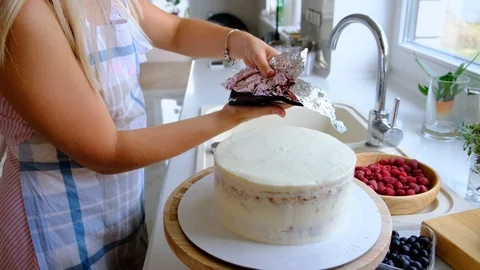 A confectioner prepares a cream cake. Stock Footage 113017619